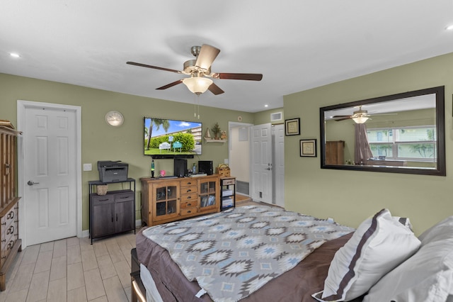 bedroom featuring a ceiling fan, light wood-type flooring, visible vents, and recessed lighting