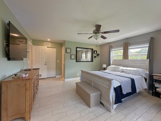 300 NE 26th Ave Unit 114, Boynton Beach, FL 33435 - bedroom with a ceiling fan, baseboards, visible vents, and recessed lighting