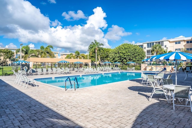 300 NE 26th Ave Unit 114, Boynton Beach, FL 33435 - pool with a patio area and fence