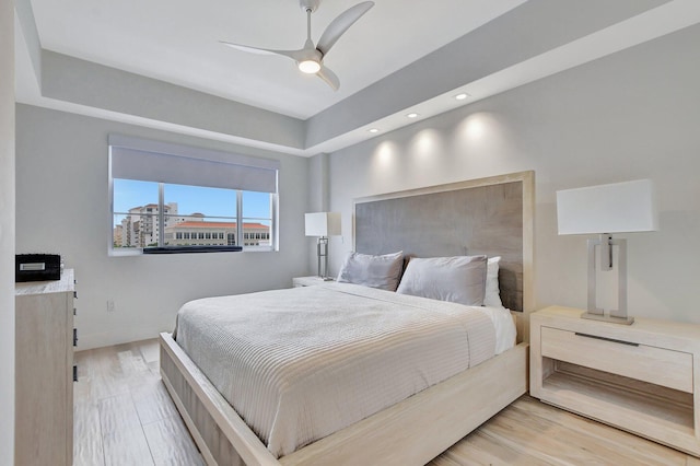 bedroom featuring light wood-type flooring and ceiling fan