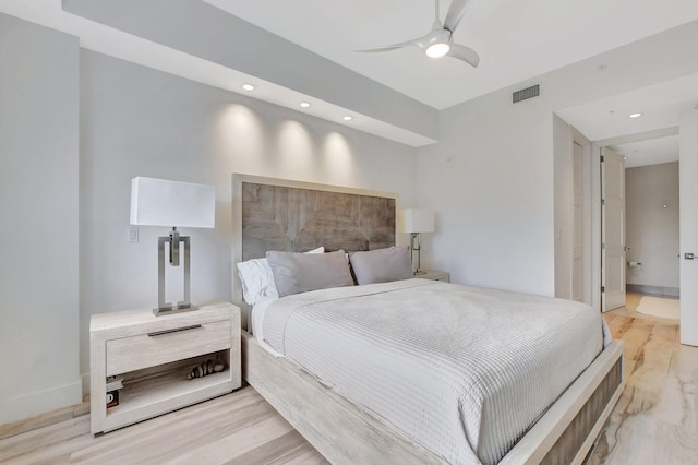 bedroom featuring ceiling fan and hardwood / wood-style floors