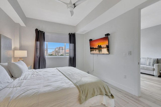 bedroom with light hardwood / wood-style flooring and ceiling fan