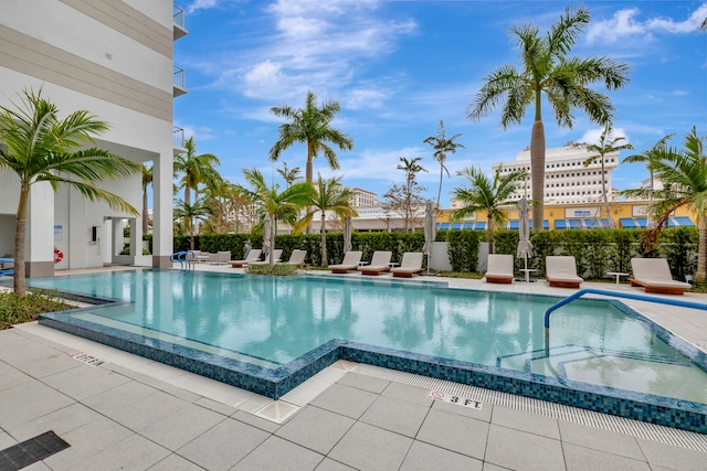 view of swimming pool with a patio area