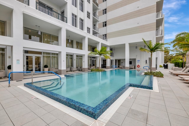 view of swimming pool with a patio