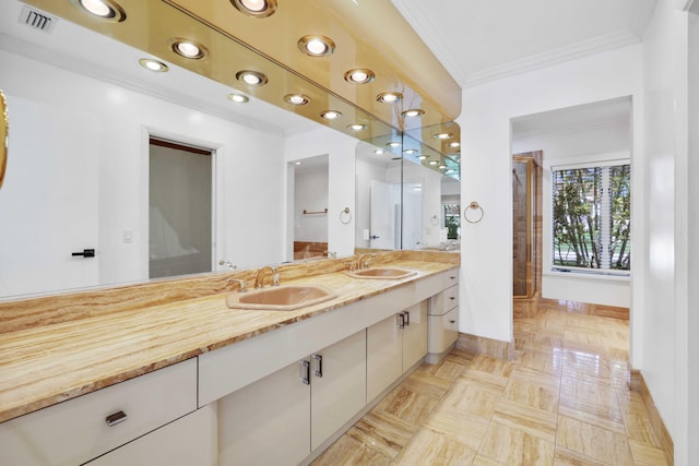 bathroom with vanity and crown molding