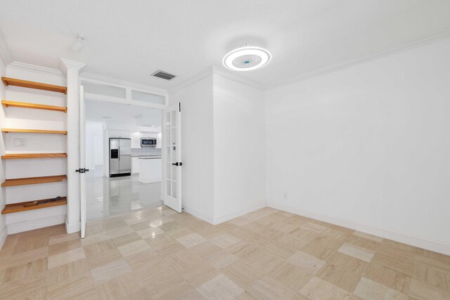 spare room featuring ornamental molding