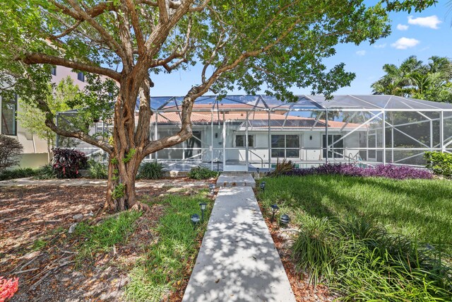 view of front of house featuring a lanai