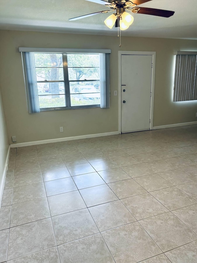 foyer entrance featuring ceiling fan and light tile patterned floors