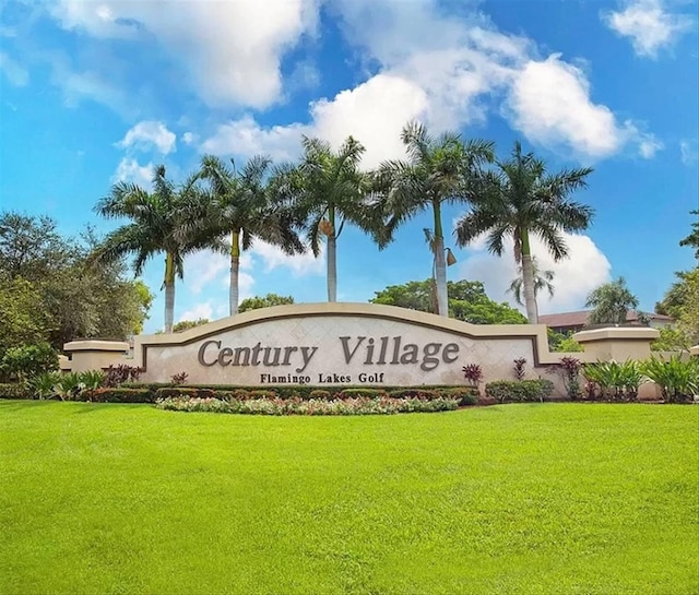 community sign with a lawn