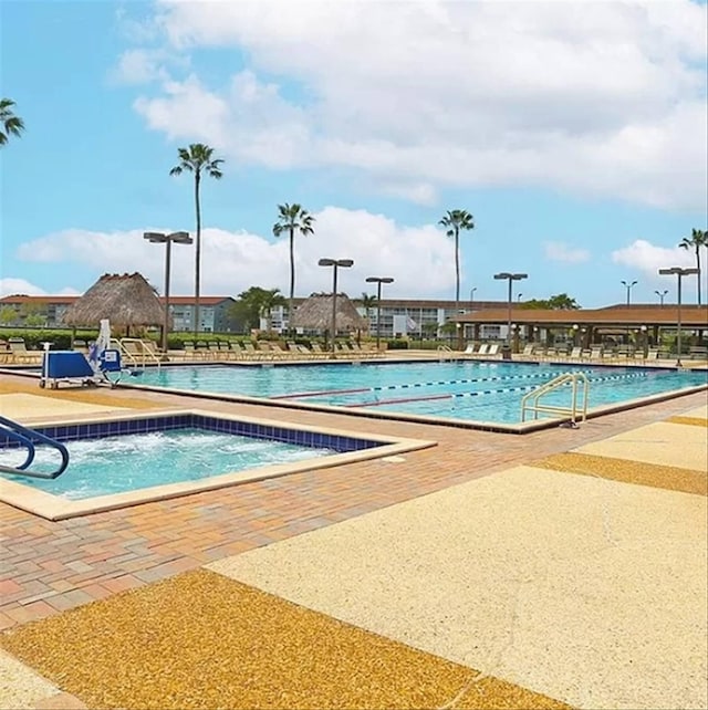 view of swimming pool featuring a patio area