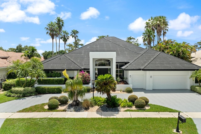 view of front of property with a garage