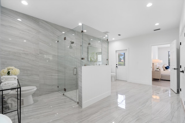 bathroom with toilet, tile patterned floors, and walk in shower