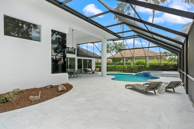 view of swimming pool featuring a lanai and a patio area