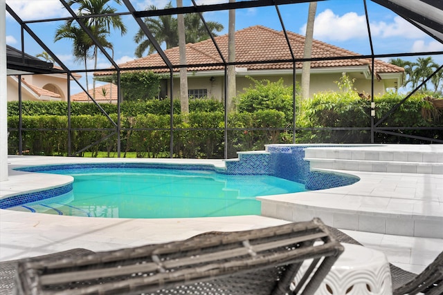 view of pool featuring a lanai and a patio