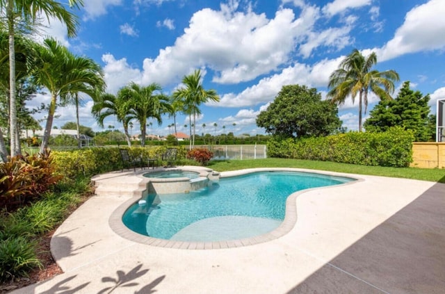 view of swimming pool with an in ground hot tub and a patio