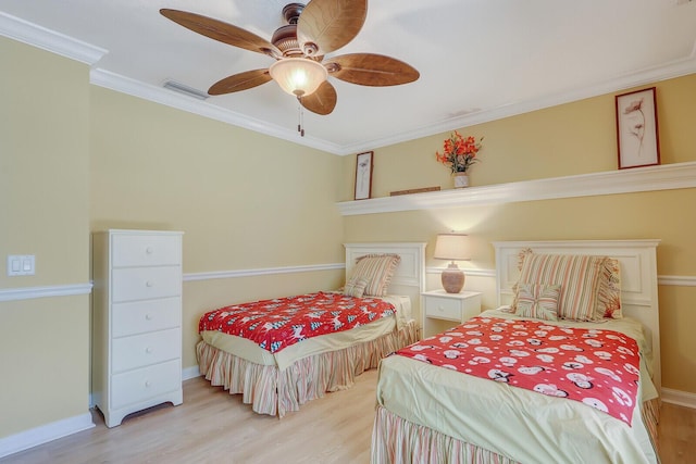 bedroom with crown molding, ceiling fan, and light wood-type flooring