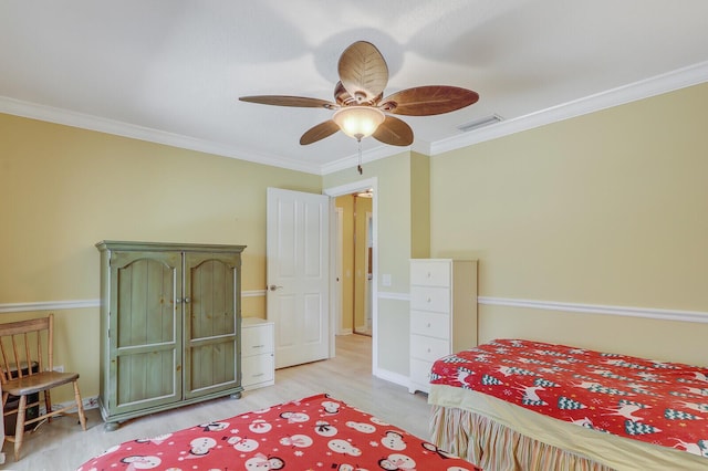 bedroom with crown molding, ceiling fan, and light wood-type flooring