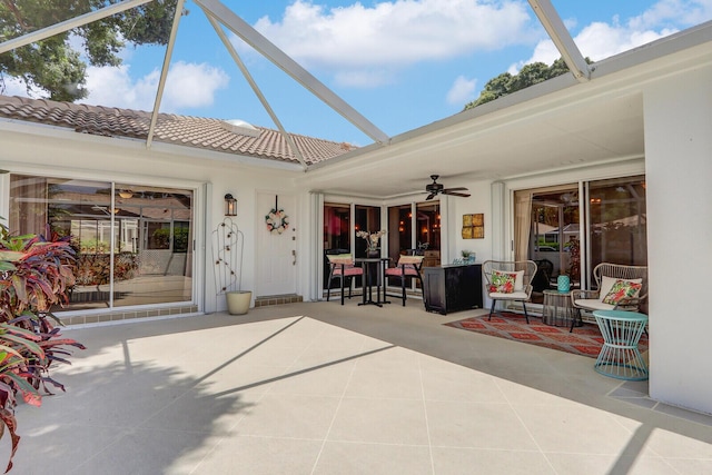 exterior space with a lanai and ceiling fan