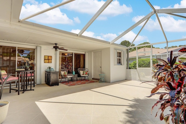 view of patio with a lanai and ceiling fan