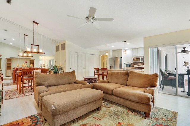 living room featuring light hardwood / wood-style floors and ceiling fan