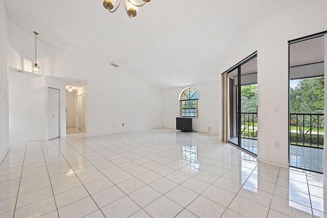 unfurnished living room featuring a notable chandelier, light tile patterned floors, and vaulted ceiling