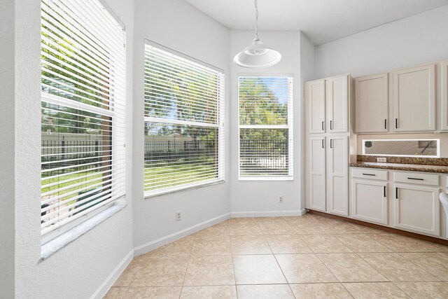 unfurnished room featuring light tile patterned flooring