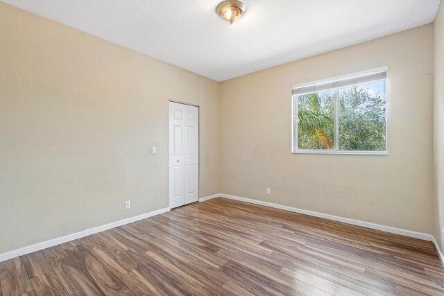 empty room featuring hardwood / wood-style flooring