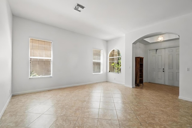 unfurnished room with light tile patterned floors