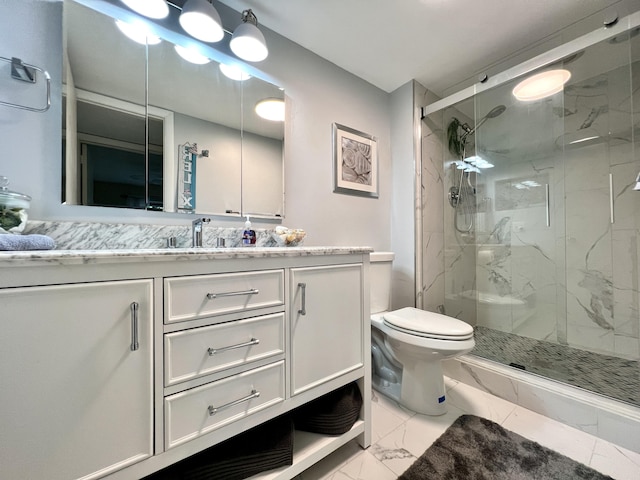 bathroom with an enclosed shower, vanity, and toilet