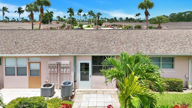 entrance to property with central AC unit