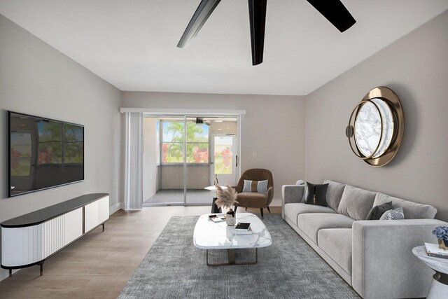 living room with ceiling fan and light wood-type flooring