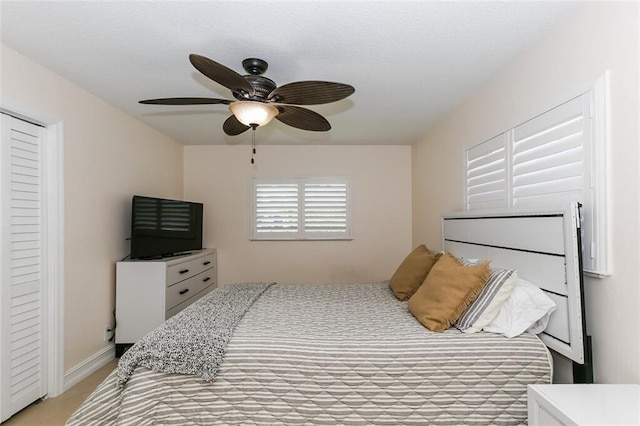 bedroom with light colored carpet and ceiling fan