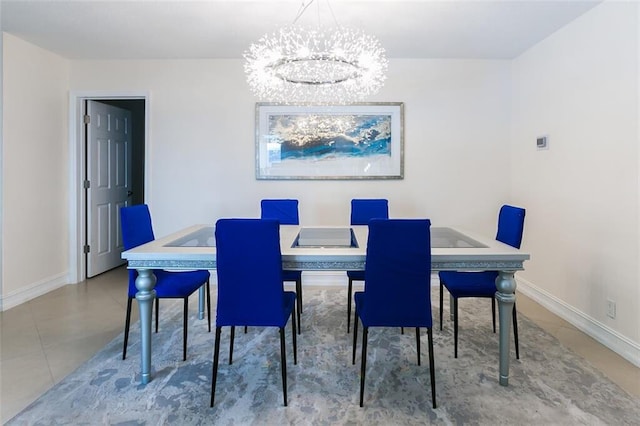 tiled dining room featuring a chandelier