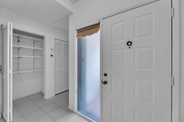 view of tiled entrance foyer