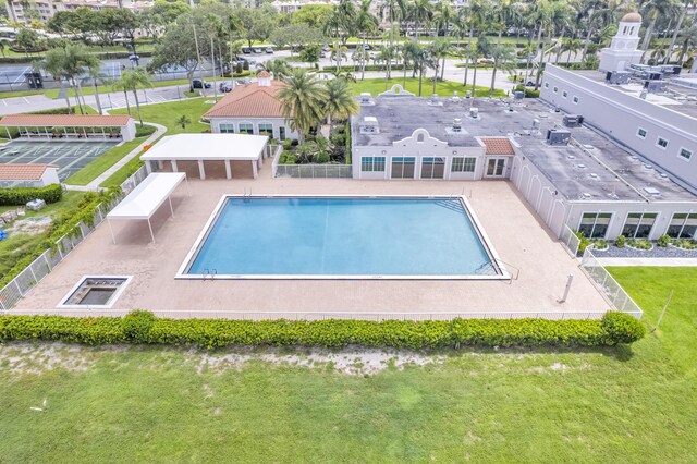 view of pool featuring a patio area and a lawn