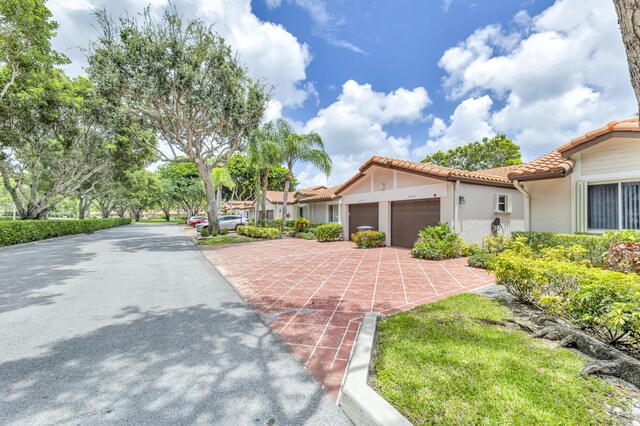 mediterranean / spanish house with a garage