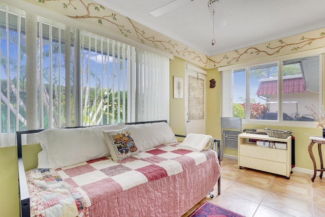 bedroom featuring ceiling fan and light tile patterned flooring