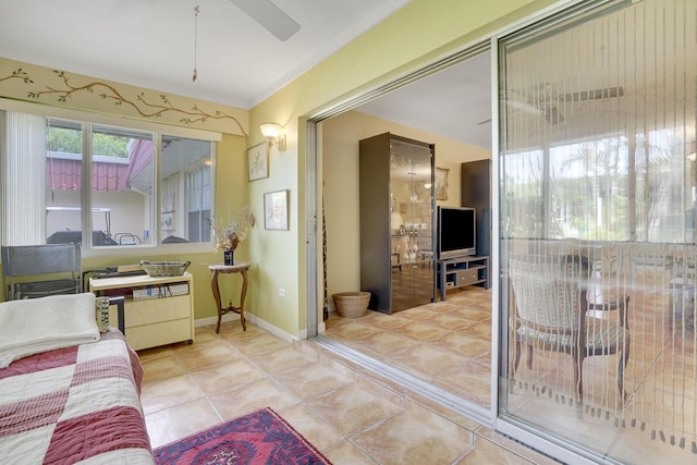 tiled living room featuring ceiling fan