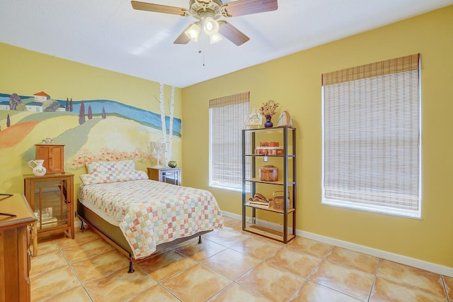 bedroom with light tile patterned floors and ceiling fan