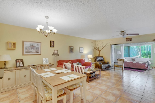 dining room with light tile patterned flooring, a textured ceiling, and ceiling fan with notable chandelier