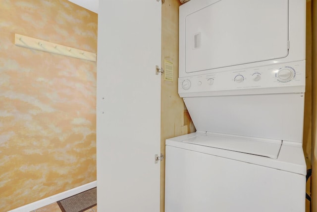 laundry room featuring stacked washing maching and dryer