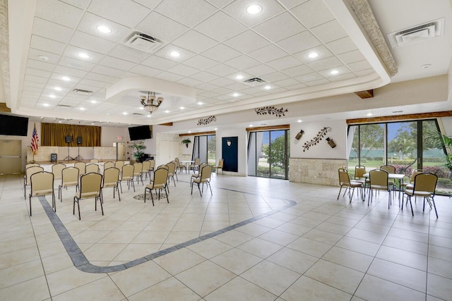 tiled dining room featuring a chandelier