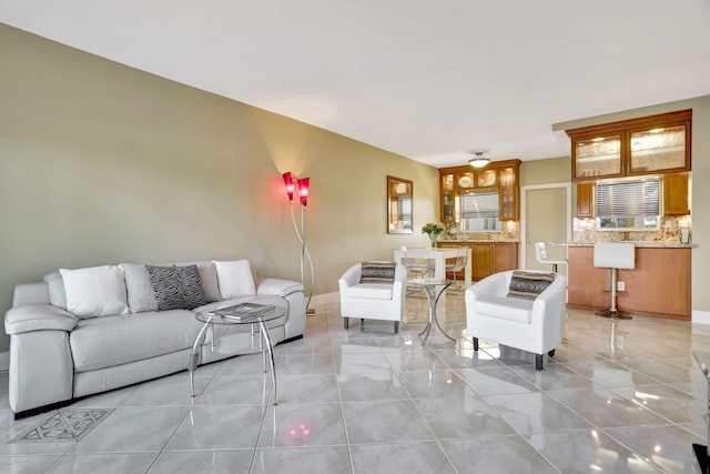 living room with light tile patterned flooring