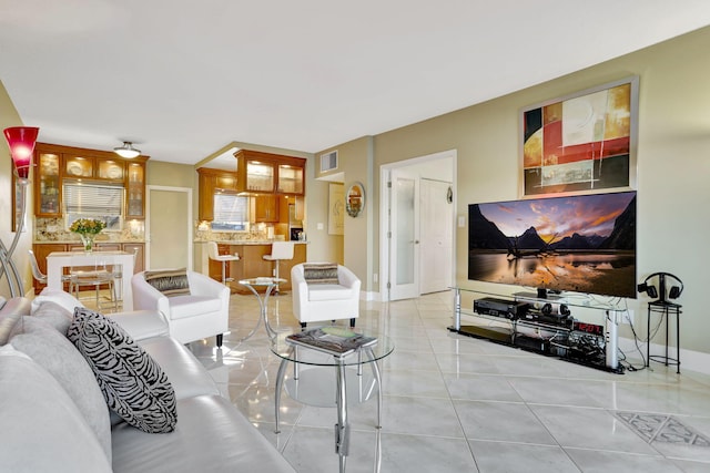 living room featuring light tile patterned flooring