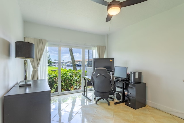 office area featuring ceiling fan, plenty of natural light, and light tile patterned floors