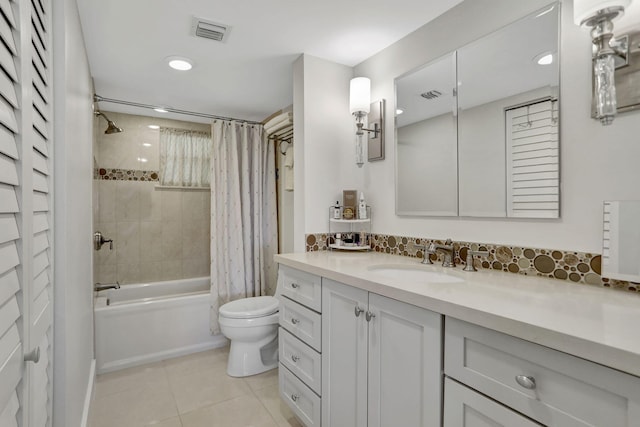 full bathroom featuring shower / tub combo, tile patterned floors, vanity, and toilet