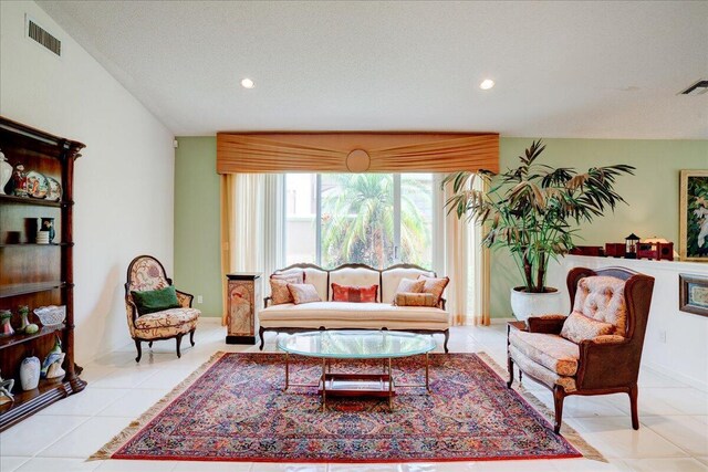 tiled living room with a textured ceiling