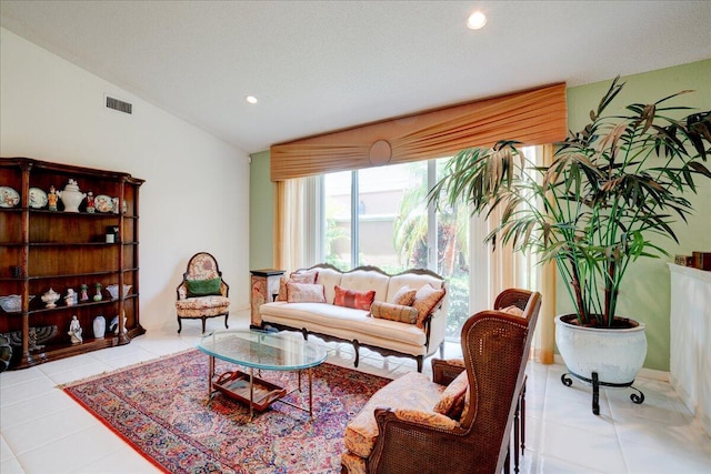 tiled living room with vaulted ceiling