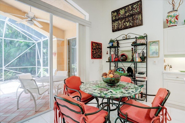 tiled dining room with ceiling fan