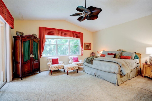 bedroom featuring light carpet, ceiling fan, and vaulted ceiling